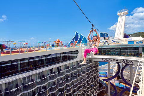 Zip line above the pool deck of a ship at sea