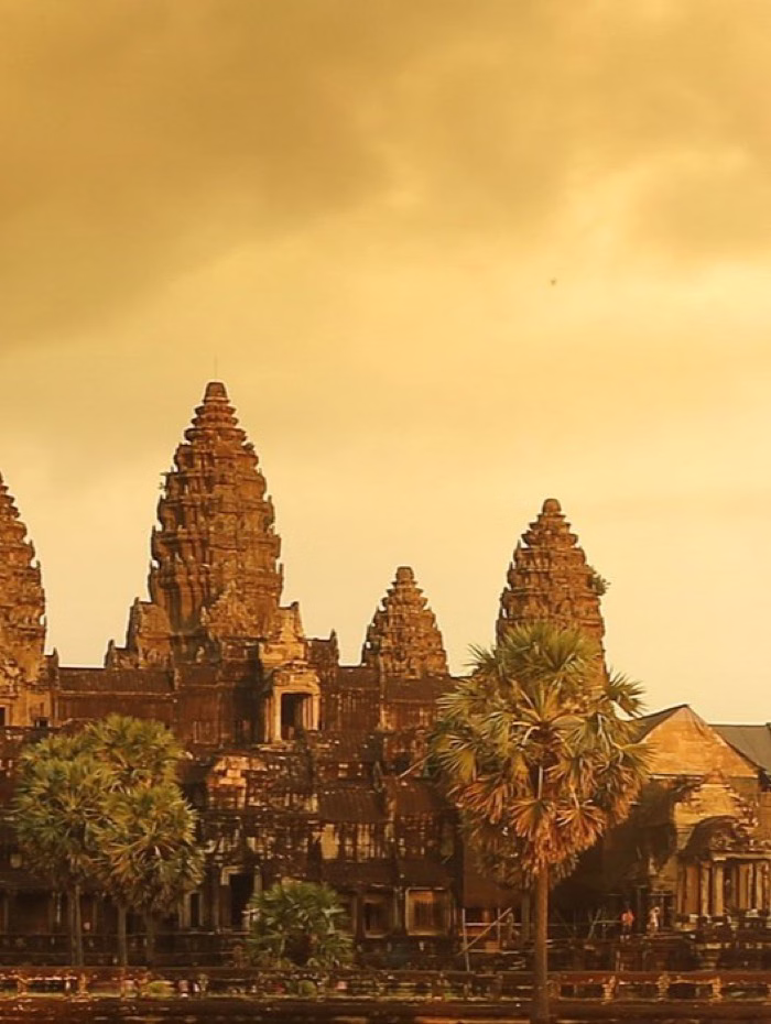 Angkor Wat temple towers beneath a golden sky, Cambodia