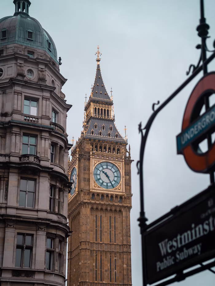 Big Ben above the Westminster Underground entrance at dusk
