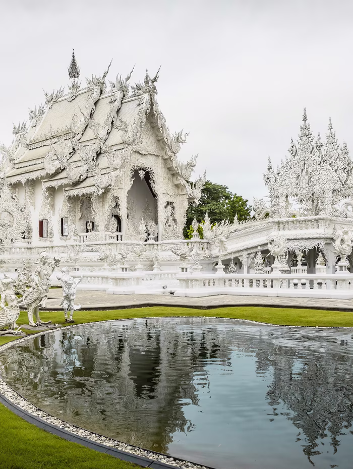 The White Temple at Chiang Rai, mirrored in its pool